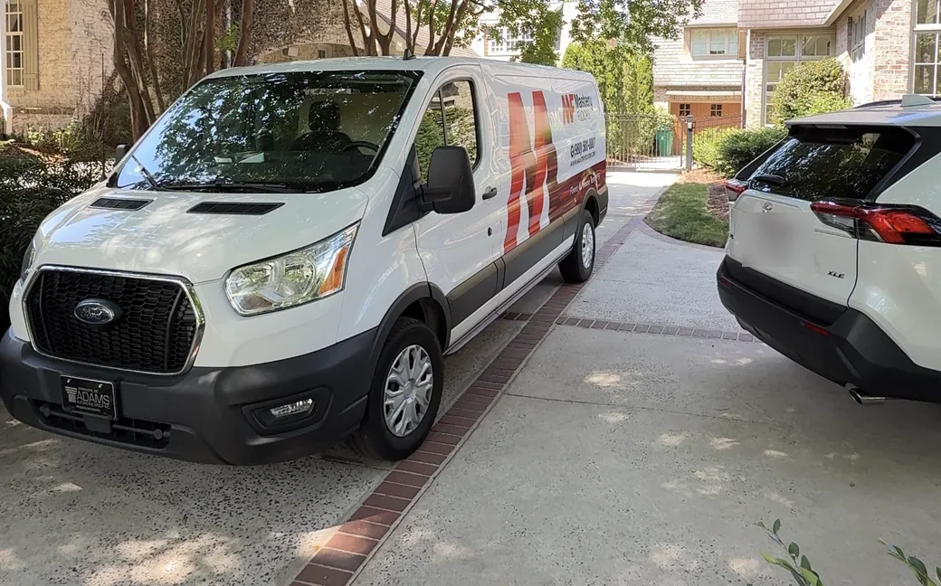 Mastery Floors van parked in the driveway of a Charlotte home